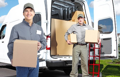 Staff preparing technology and documents for an office move in Wanstead